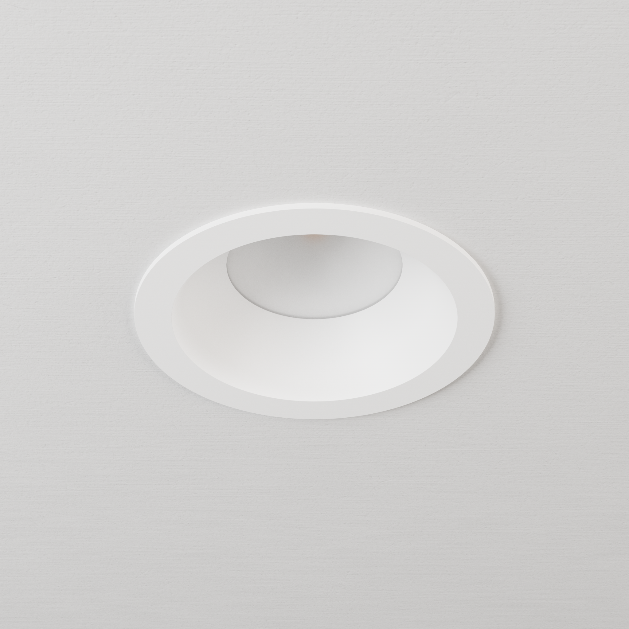 DMF Lighting C4TRSWH C-Series 4 inch standard round trim in white, shown in ceiling.