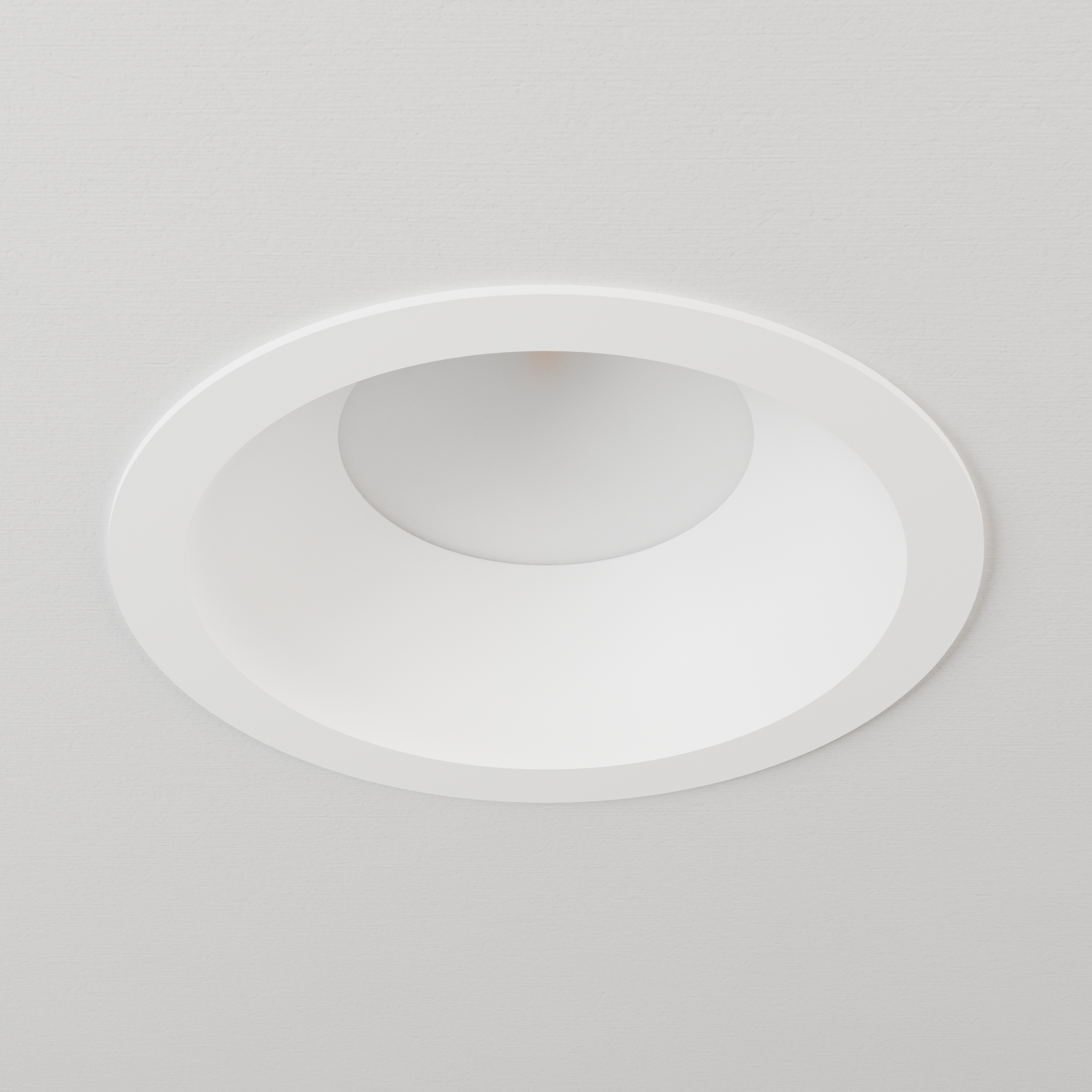 DMF Lighting C6TRSWH C-Series 6 inch standard round trim in white, shown in ceiling.